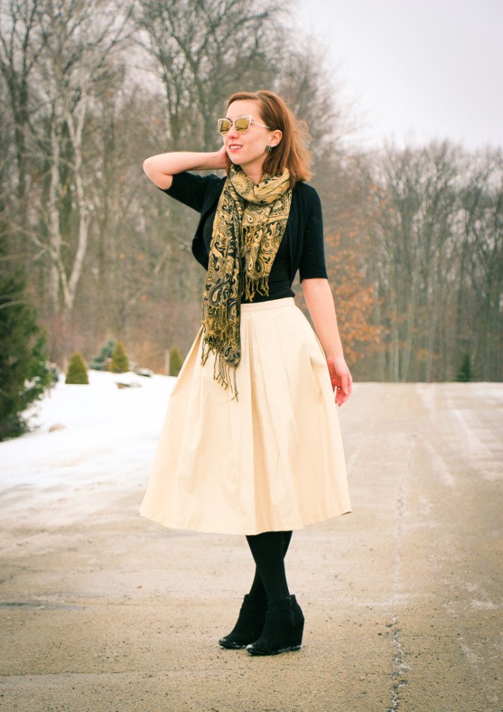 Pleather skirt Paired with black tights and black booties