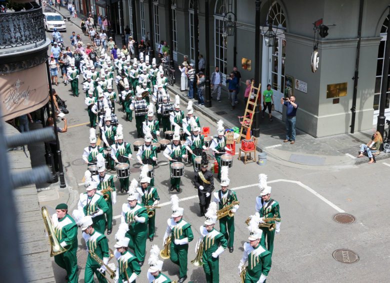 A parade coming through Royal Street