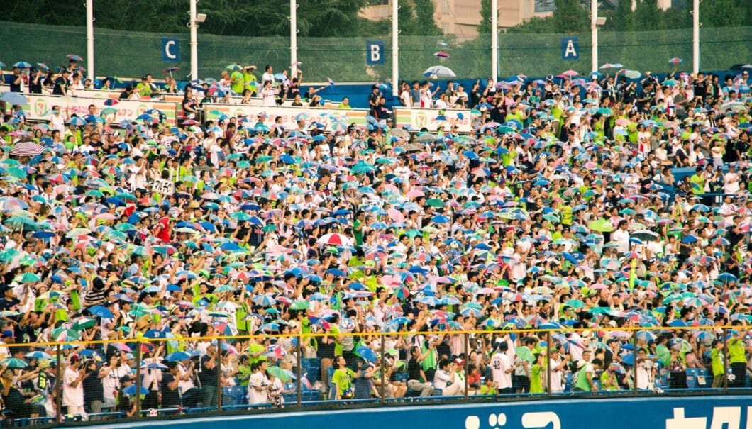 A giant crowd of Japanese baseball fans at a Swallows game on a gorgeous, sunny day.