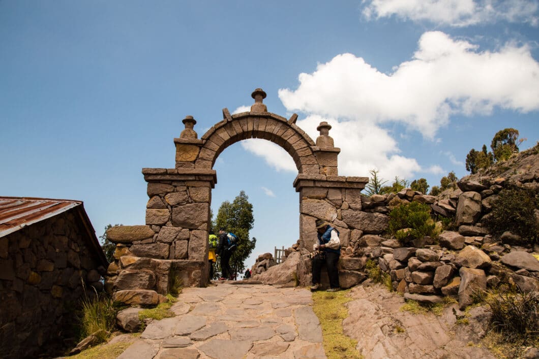 A stone archway leading to the top of a hill at Taquile Island.