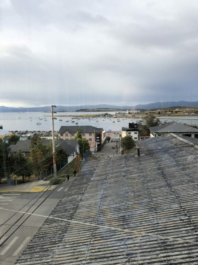 A view from Hotel Mustapic's window of Ushuaia, Argentina, with mountains in the background.