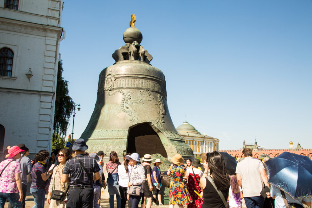 Visitors gather around the Tsar Bell, the world's largest bell, which is on display in an outdoor courtyard in the Kremlin.