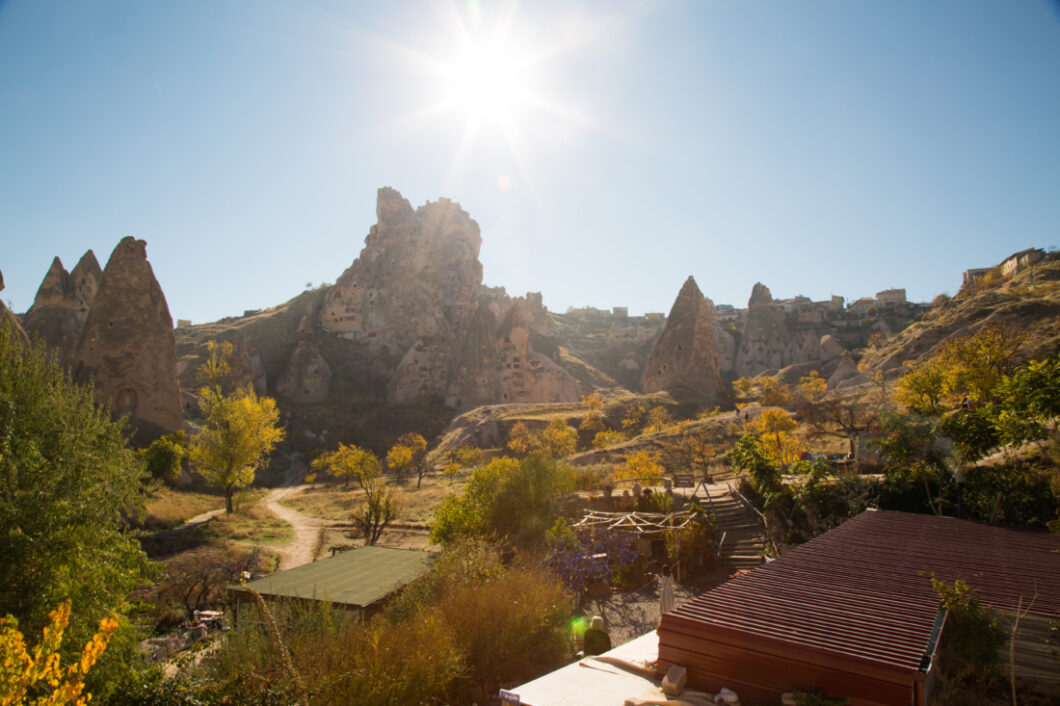 Uchisar Castle, volcanic tock castle in the morning with the sun behind it