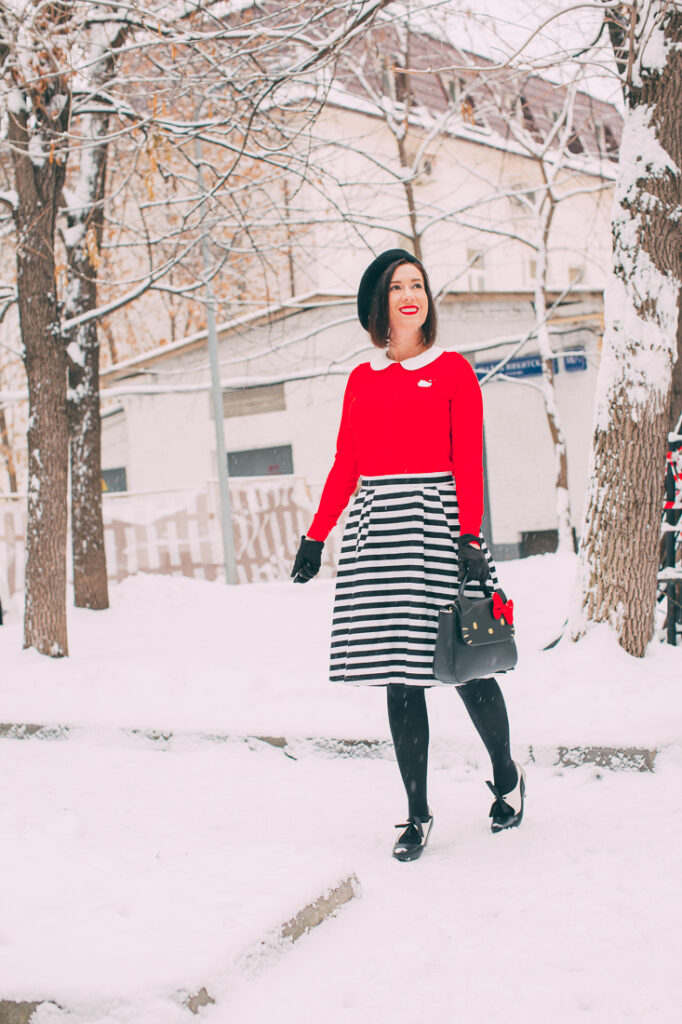 ModCloth x Hello Kitty outfit featuring a hello kitty purse, striped midi skirt, red sweater