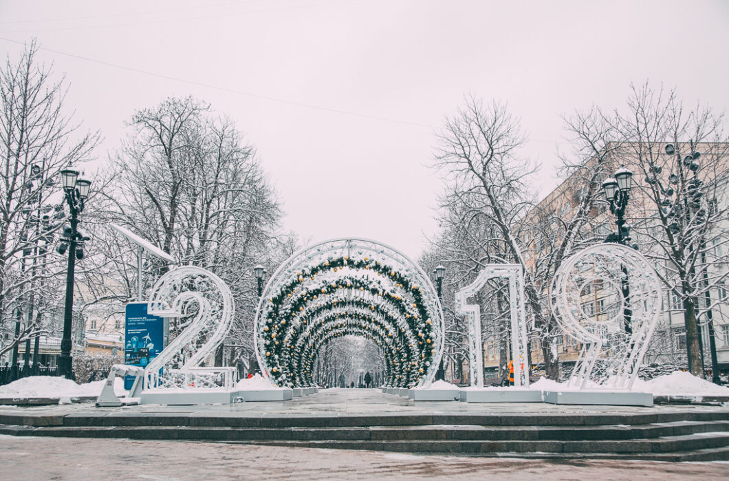 A 2019 New Year's display with giant light-up numbers and a decorated tunnel installation in the heart of Moscow, Russia on a snowy winter day.