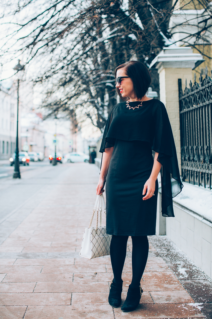 Grace Karin Black Cape Dress paired with black tights, and ankle boots