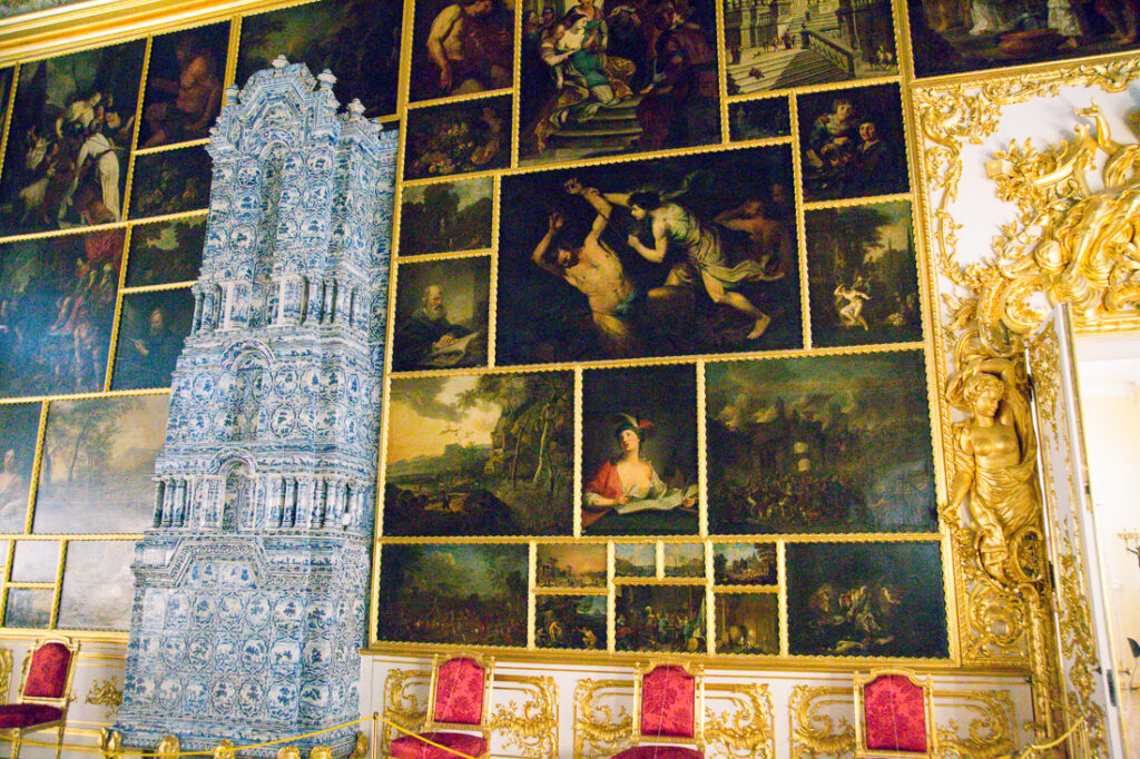 A wall of artwork on display inside Catherine Palace in Russia.