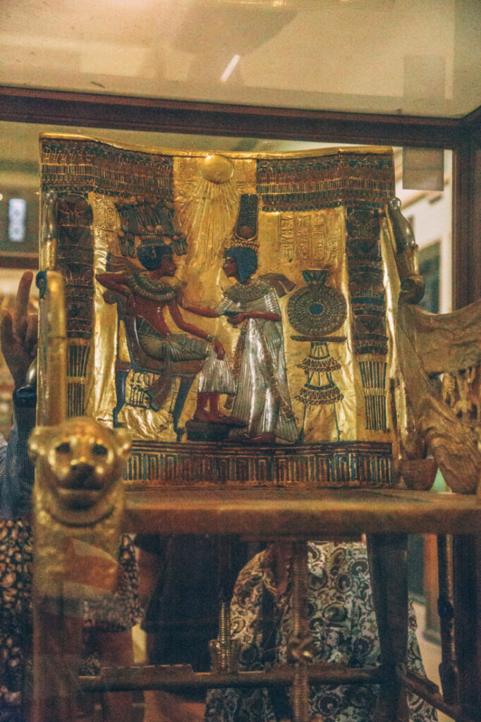 King Tut's Throne - a chair carved of wood and adorned with ornate gold artwork and carvings.