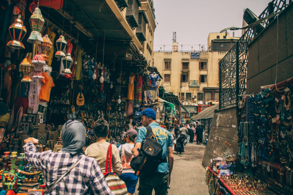 Shoppers browse the stalls that line the Khan El Khalili Bazaar, selling everything from clothes to jewelry and souvenirs. 