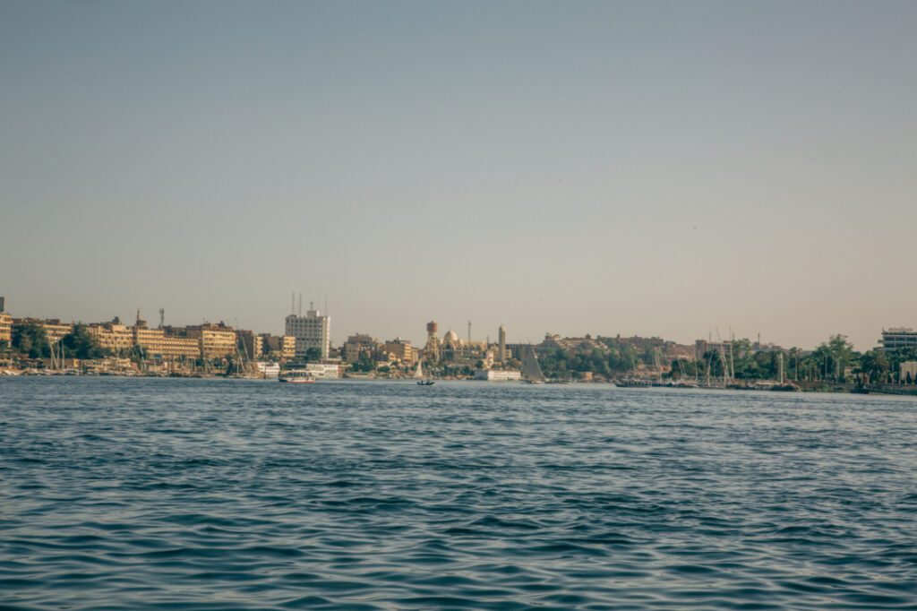 The Nubian Village sits in the distance along the banks of the Nile River in Aswan.