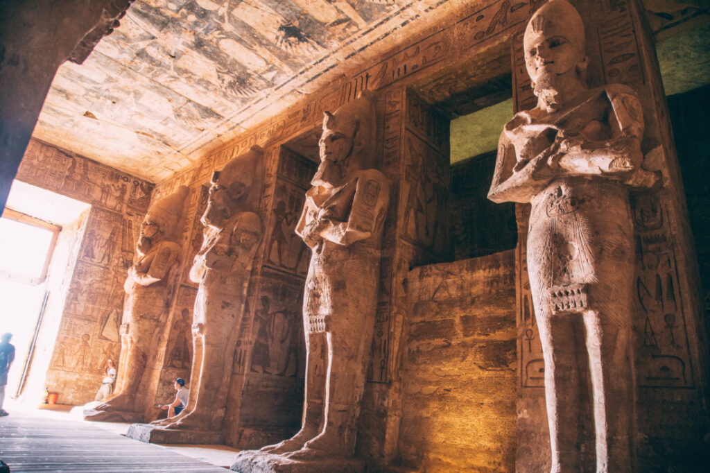 A row of giant statues that line the interior entrance of the Ramses II temple in Abu Simbel.