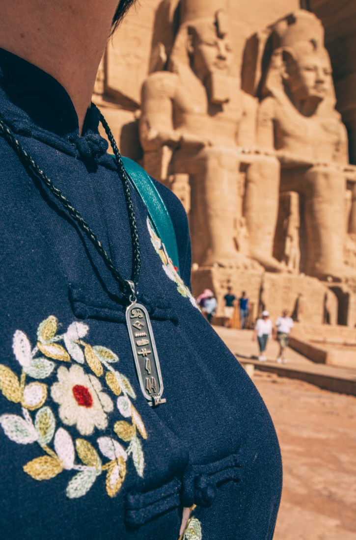 A closeup shot of the author nearing a personalized Cartouche (Hieroglyphics necklace) in Egypt.