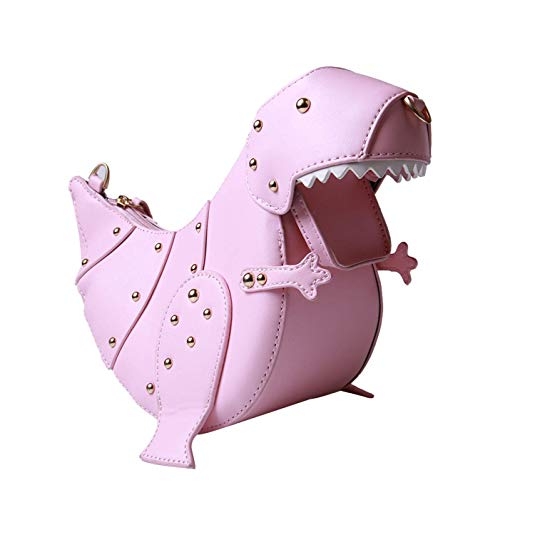 This novelty purse is shaped like a pink dinosaur. The pink leather clutch has gold studs and a zipper down the back of the dinosaur.
