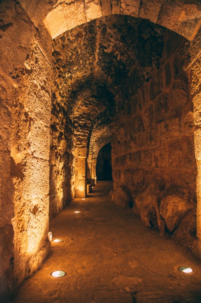 An archway with lights in the middle of a Ajloun Castle, Jordan.