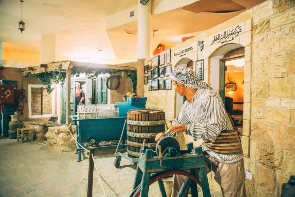 A man is working on a wheel in La Storia Tourism Complex.