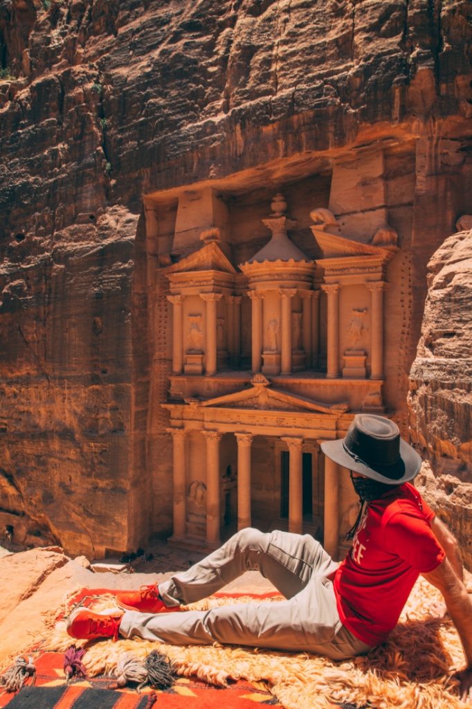 Zac wearing Helly Hansen hiking pants and red shirt, looking at Petra