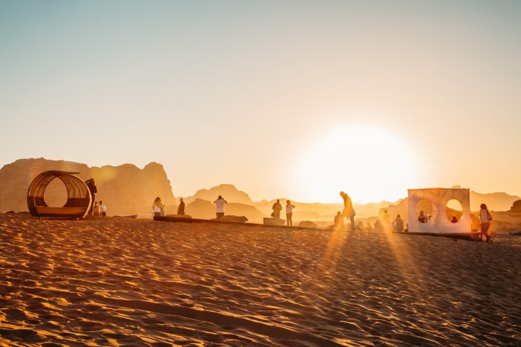 People enjoying Different seating options for the sunset. in the desert at Mazayen Rum camp in Wadi Rum Jordab