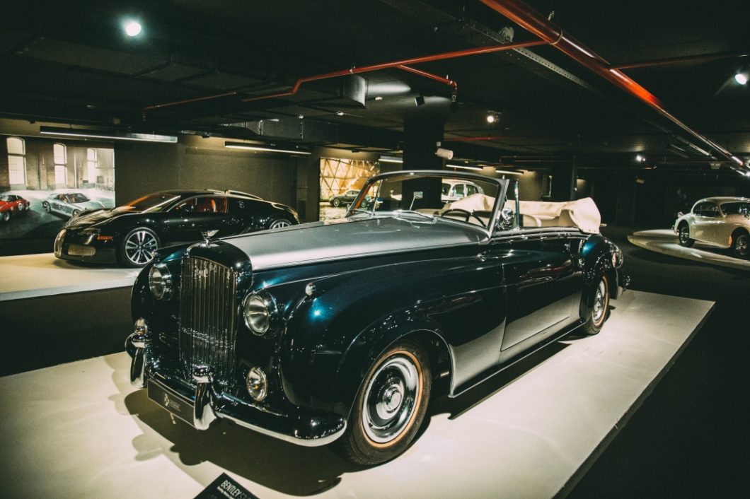 A stunning deep blue and silver 1961 Rolls Royce Silver Cloud II Drophead Coupe on display at the Heydar Aliyev Center's Classic Car Exhibit in Baku, Azerbaijan