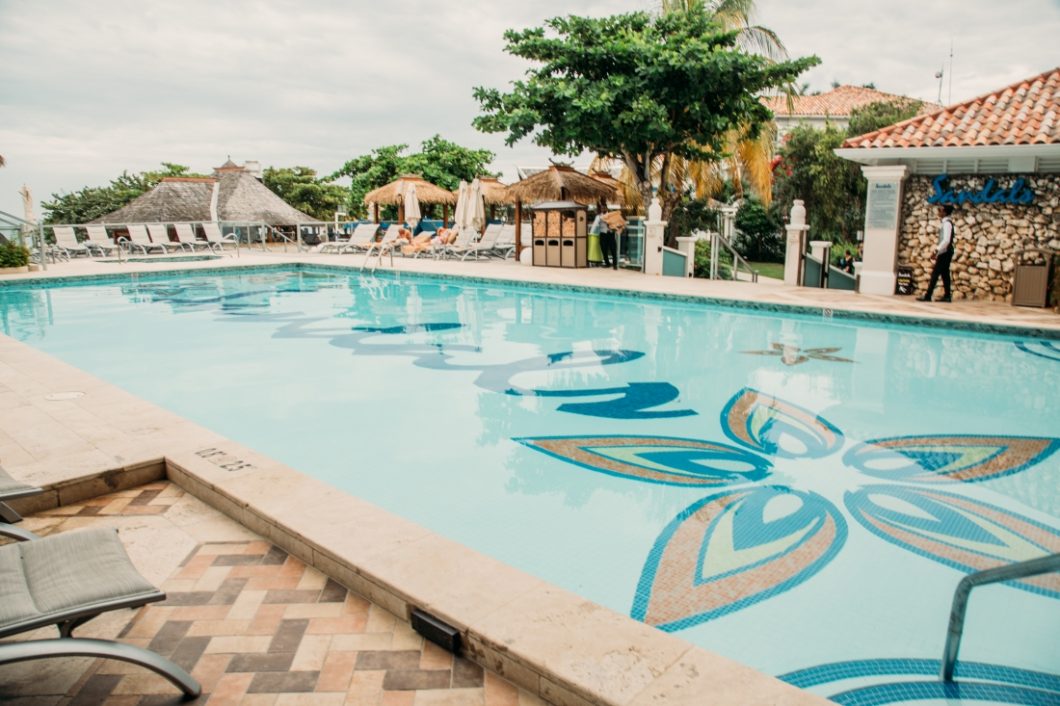 sandals montego bay pool, with lounge chairs surrounding it