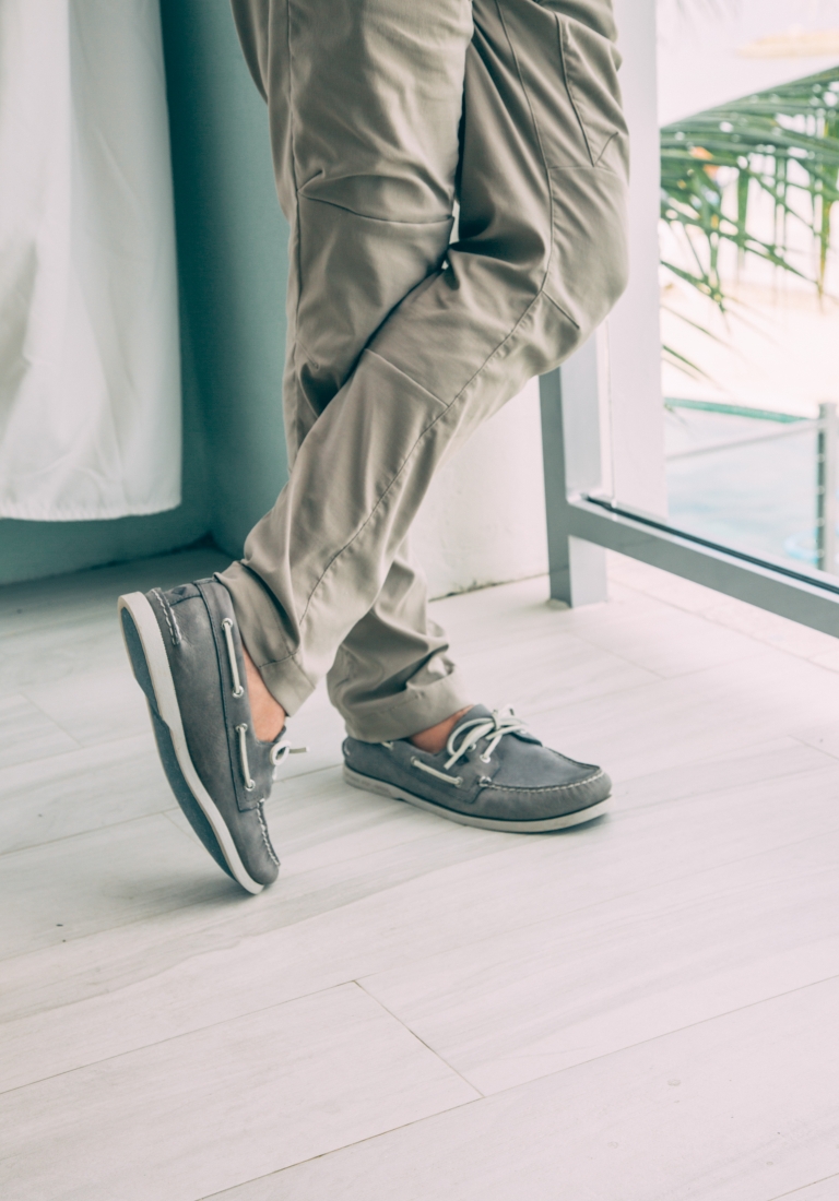 A close up of Zac's hiking pants and grey boat shoes he wore for resort evening attire