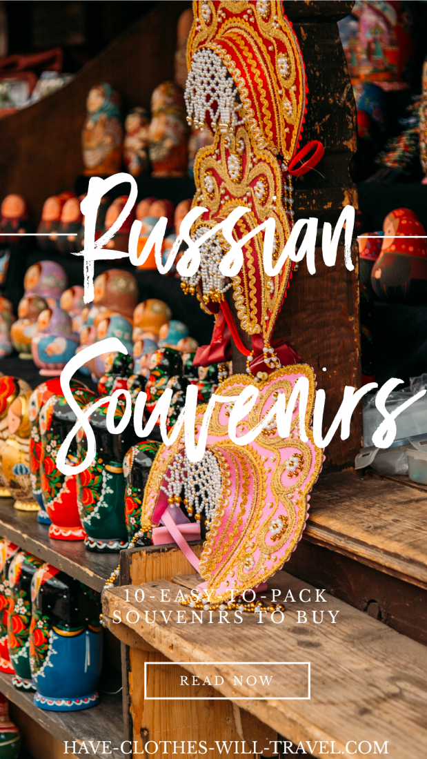 A background image of a street market vendor stall selling traditional Russian headpieces and Russian dolls. Text across the image reads "Russian Souvenirs" in white font.