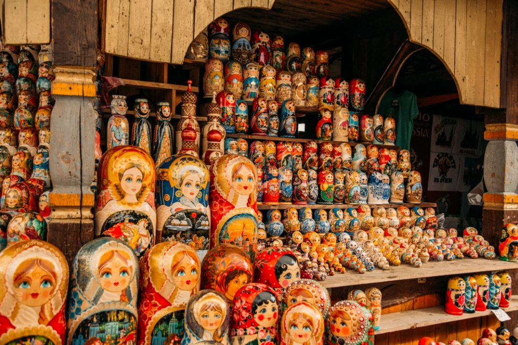 A display of hundreds of Russian nesting dolls of different sizes.