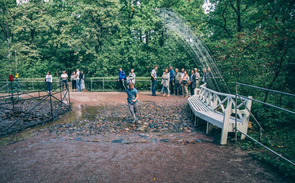 One of the "trick" fountains at Peterhof Palace- and a kiddo trying to outrun it!