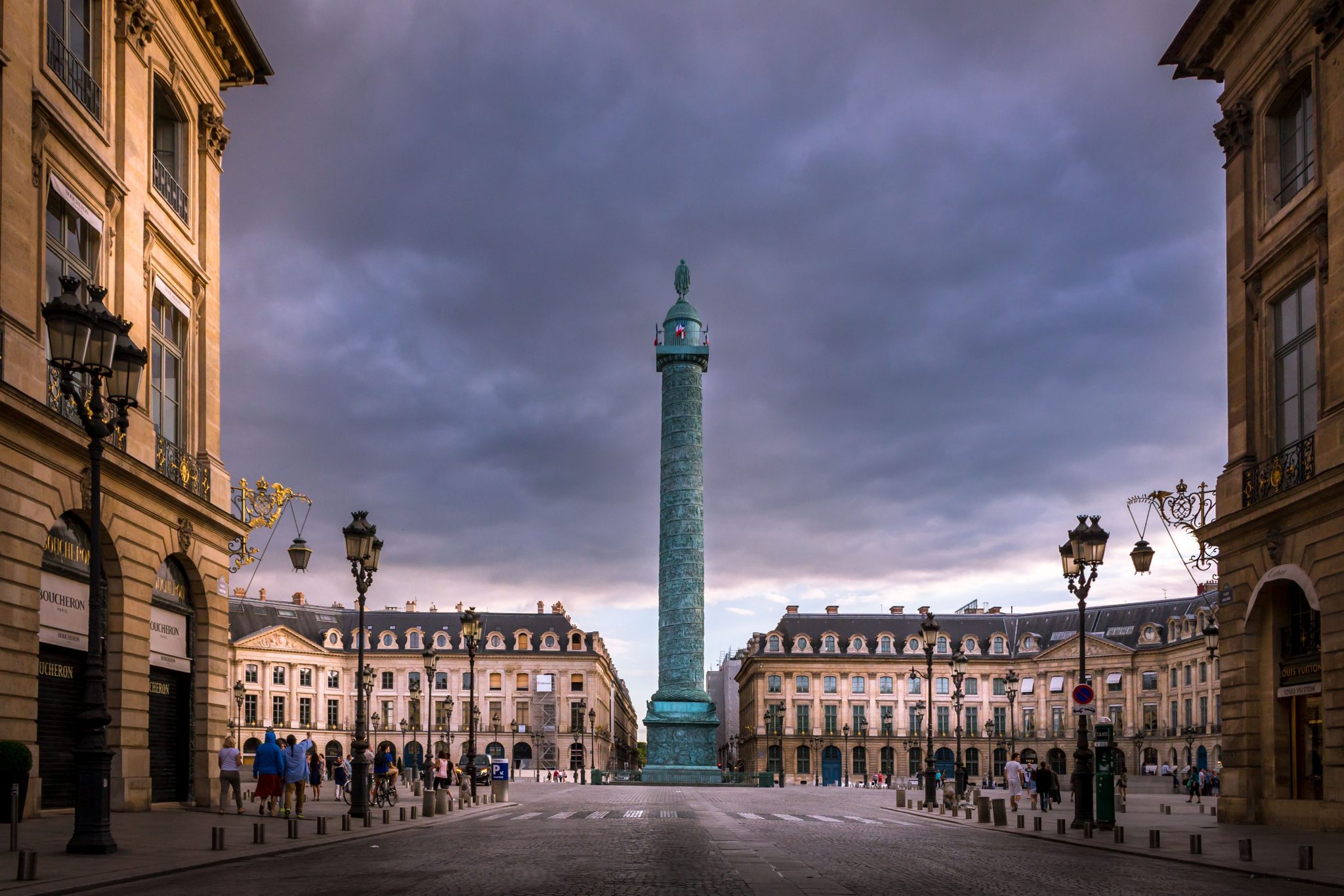 A professional photo of the Place Vendôme in Paris, France on a cloudy day.