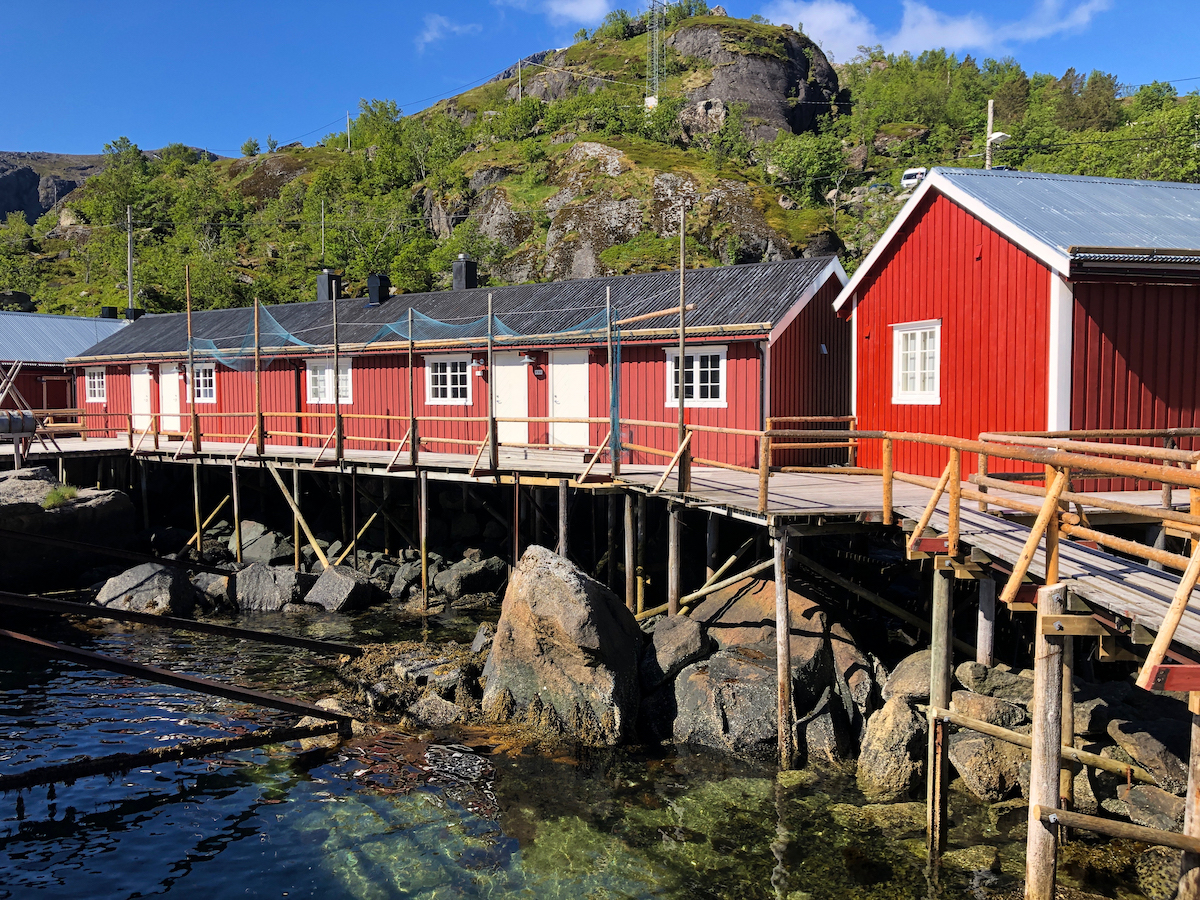 A close up of red buildings of Nusfjord Arctic Resort