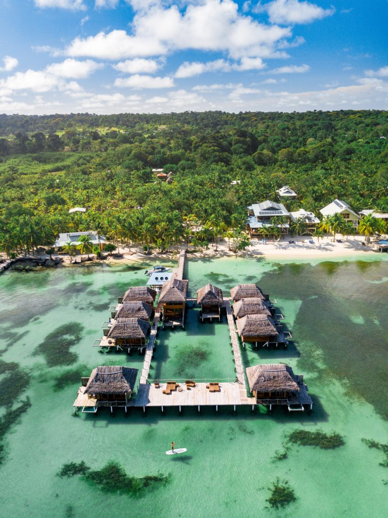 A birds eye view of the overwater bungalows and beach at Azul Paradise, Panama