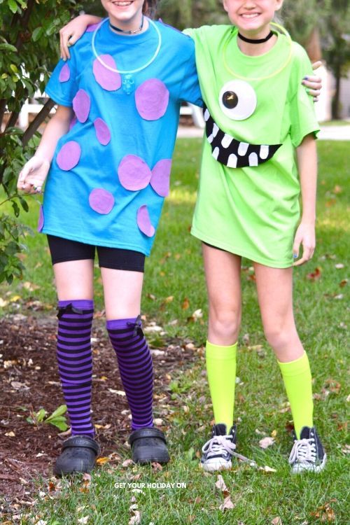 Two young girls pose together wearing matching Mike Wazowski and Sully-themed t-shirts as a DIY Halloween costume.