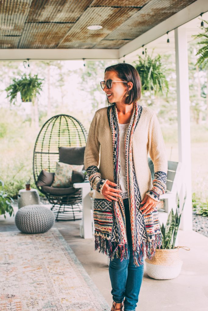 Lindsey of Have Clothes, Will Travel wears a boho Salty Crush cardigan with fringe