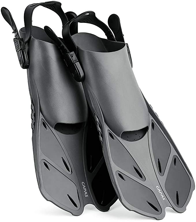 A pair of black scuba fins on a white background.