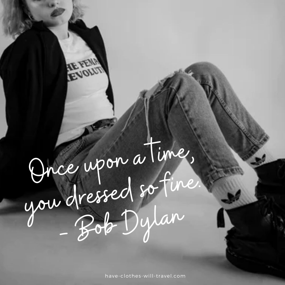 A black and white image of a woman sitting on a white floor. She's wearing jeans, a white shirt, and black coat. Text over the image says, "Once upon a time, you dressed so fine. ― Bob Dylan"