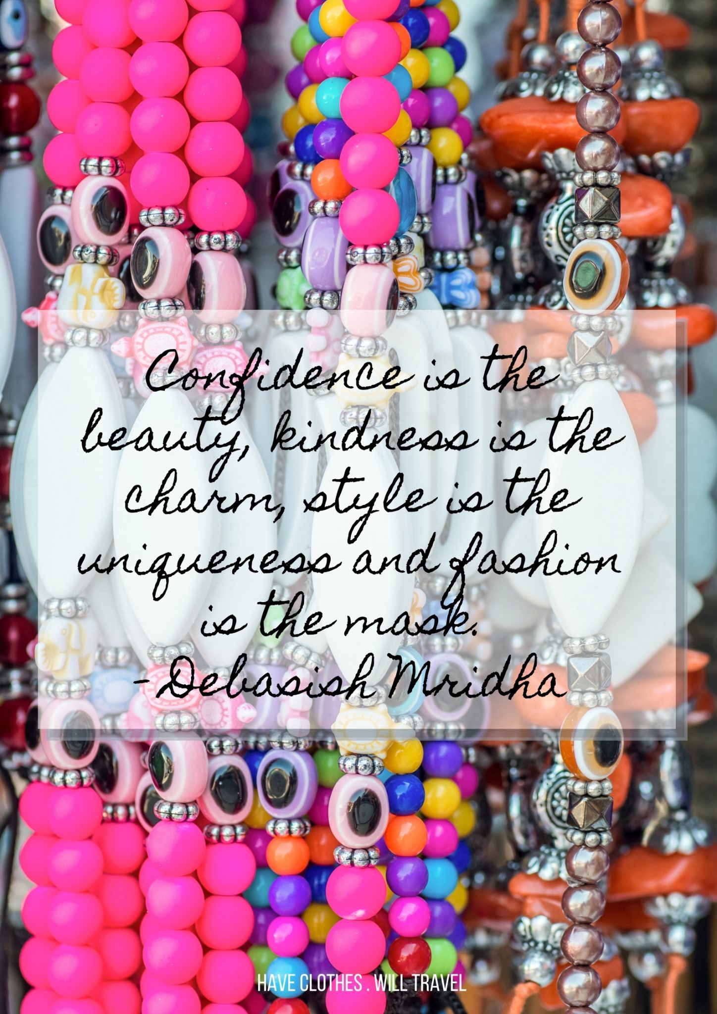 Colorful, chunky beaded necklaces hanging on a jewelry stand. Black cursive text over the image says, "Confidence is the beauty kindness is the charm and fashion is the mask. - Debasish Mridha"