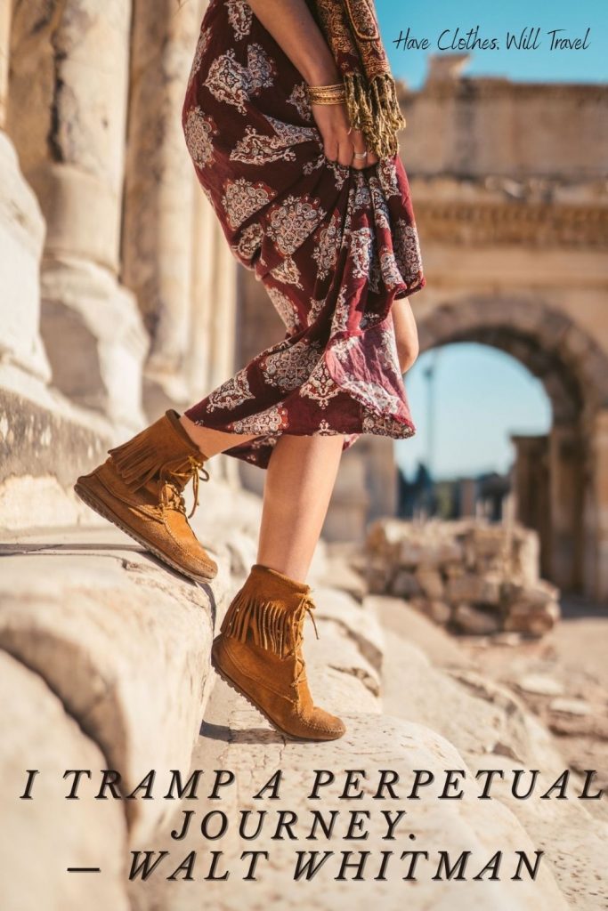 A woman wearing a dress and moccasins walks down stone steps. Black text over the image reads 