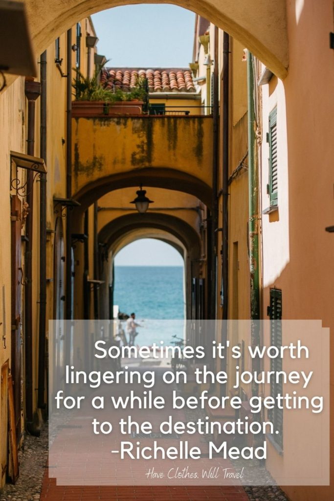A local alleyway between buildings in a sea-side town, looking out over the ocean. Text across the image says, "Sometimes it's worth lingering on the journey for a while before getting to the destination. - Richelle Mead"