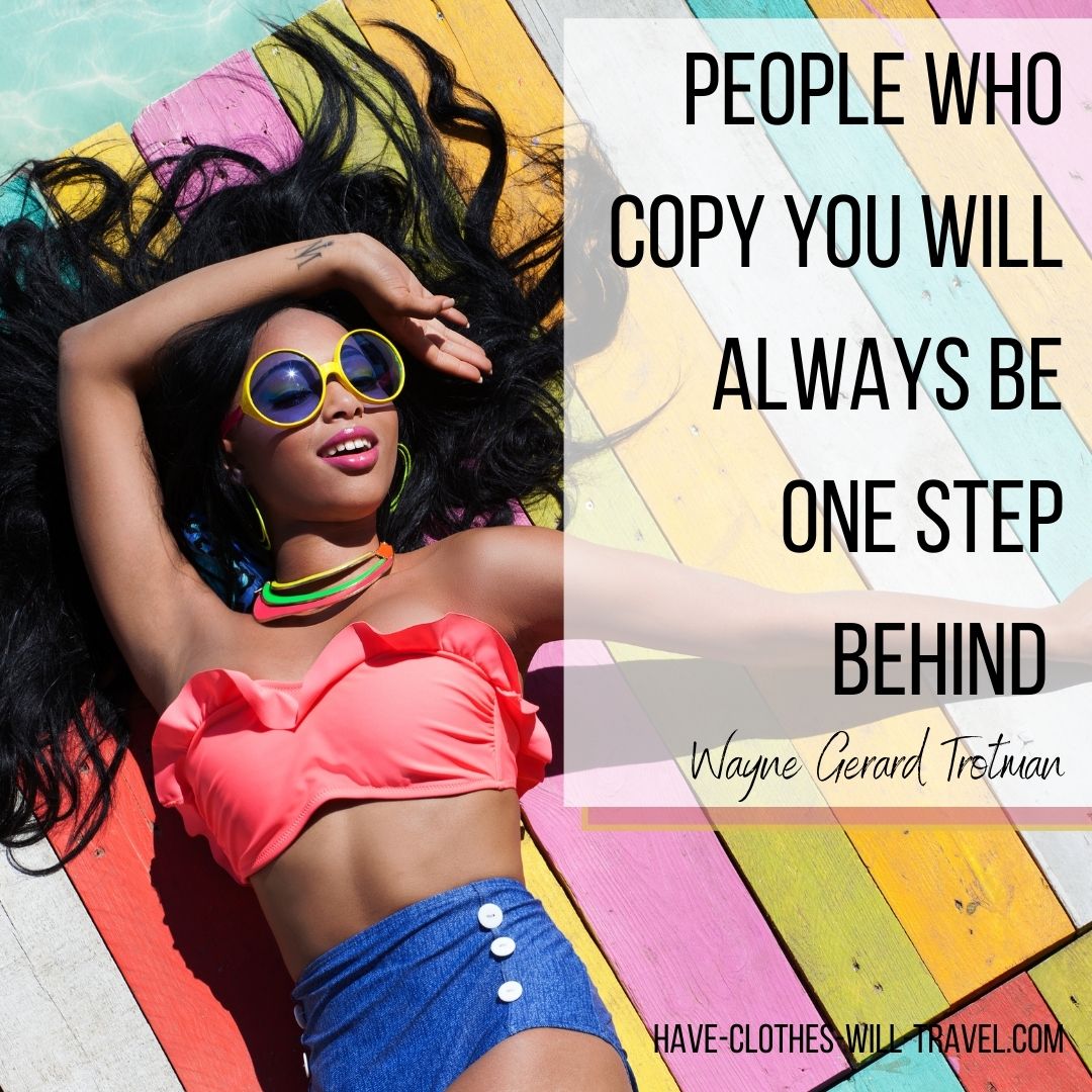 A young black woman lays on a colorful wooden pier over a pool of water. Her long black hair is spread out over the wooden planks, and she's wearing a vintage two-piece swim suit. Text over the image says, "People who copy you will always be one step behind. ― Wayne Gerard Trotman"