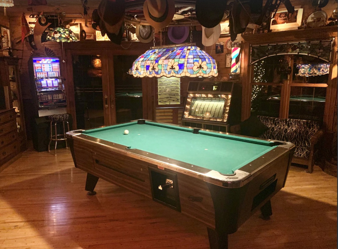 A pool table inside a cozy cabin available for rent in the Wisconsin Dells.