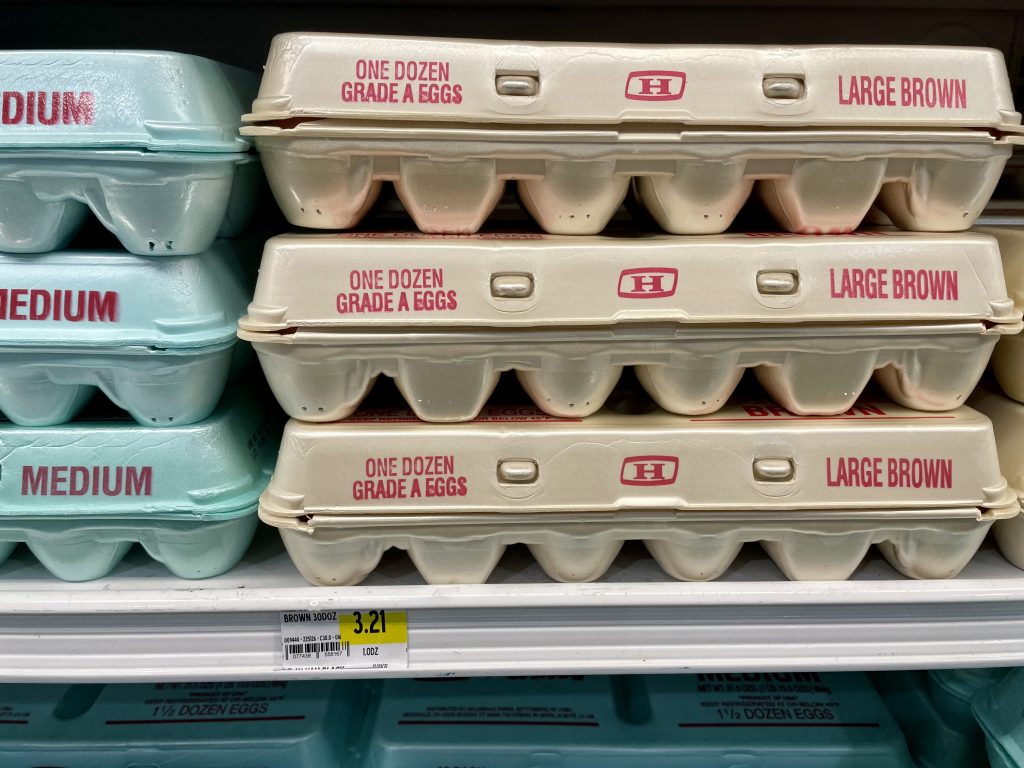 A grocery store shelf with eggs its prices in Turks and Caicos.