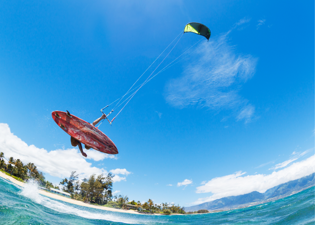 A person is kiteboarding at Long Bay Beach.