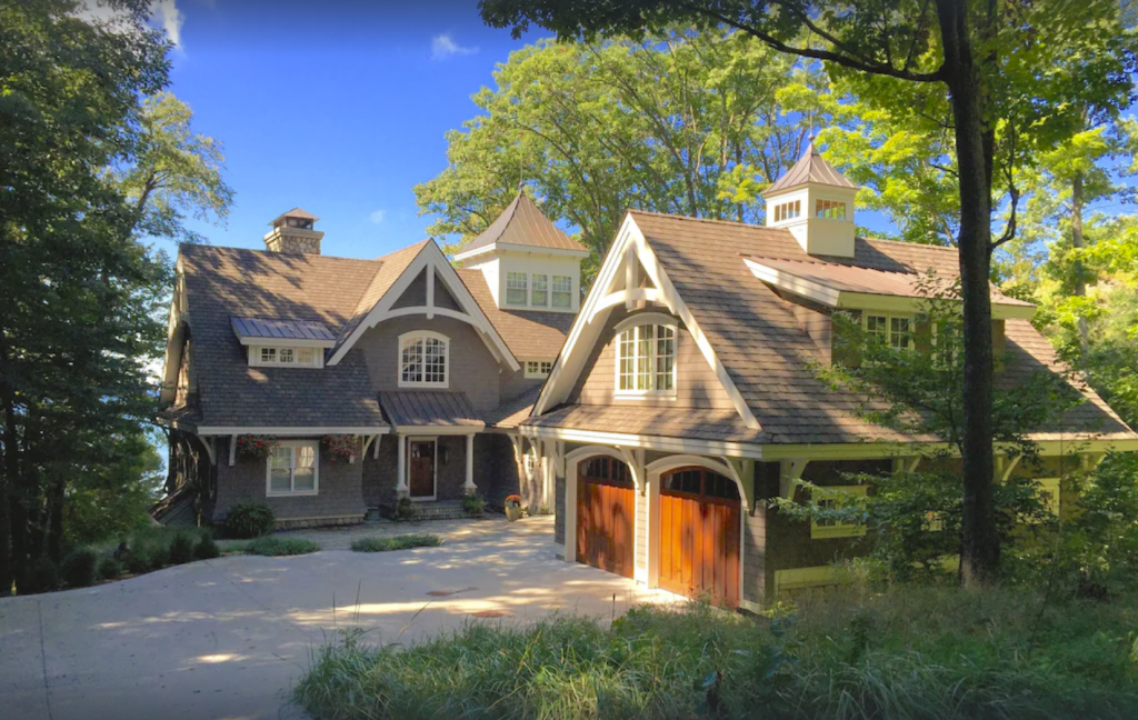 A large house in the woods with a garage - Luxury 6-bedroom Lake Michigan Beach House in Holland, Michigan.