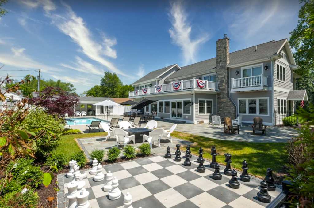 A house with a chess board in the yard - Premier Luxury Vacation Lamb Guest House in South Haven.