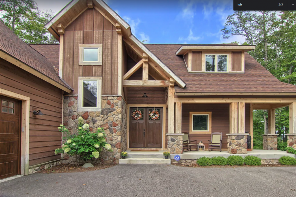 A wide angle view of a 4-bedroom Private Alpine House with Hot Tub in Boyne Mountain in Boyne Falls.