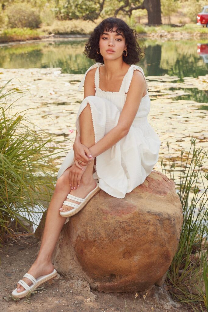 Model Wearing a Flirting in Florence White Striped Tie-Strap Midi Dress