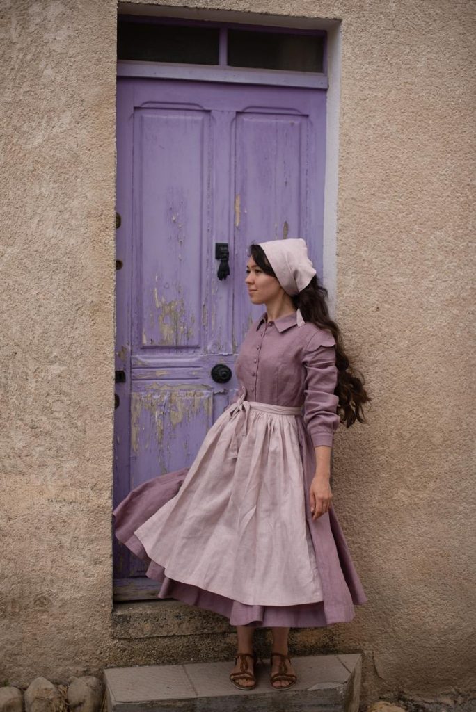 Model Wearing Little Women's Cottagecore Inspired Jo Dress Posing in front of a Door