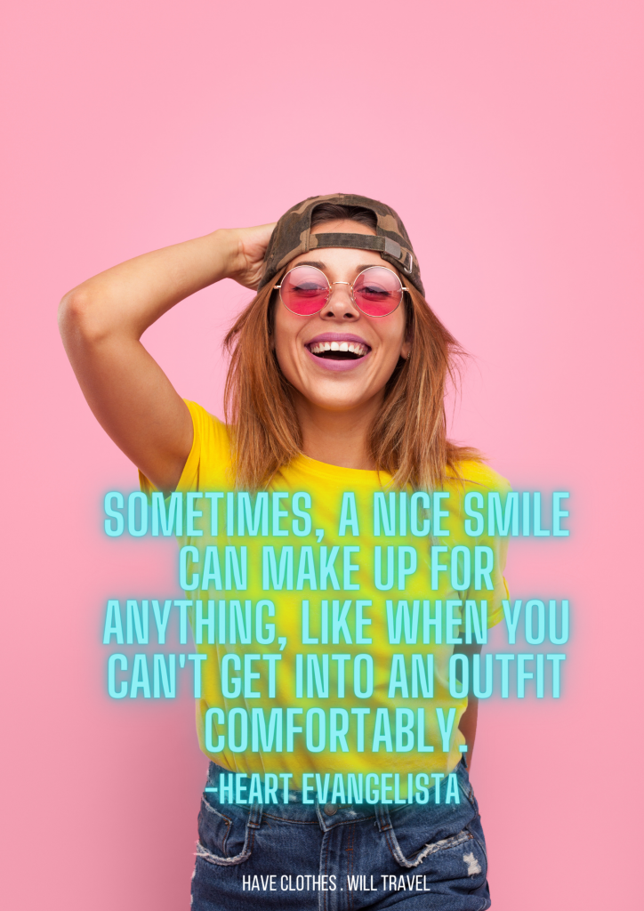 A smiling young woman stands in front of a bubblegum-pink background. She's wearing a yellow t-shirt, jeans, pink-tainted sunglasses and a backwards trucker hat. Light blue text over the image says, "Sometimes, a nice smile can make up for anything, like when you can't get into an outfit comfortably. - Heart Evangelista"