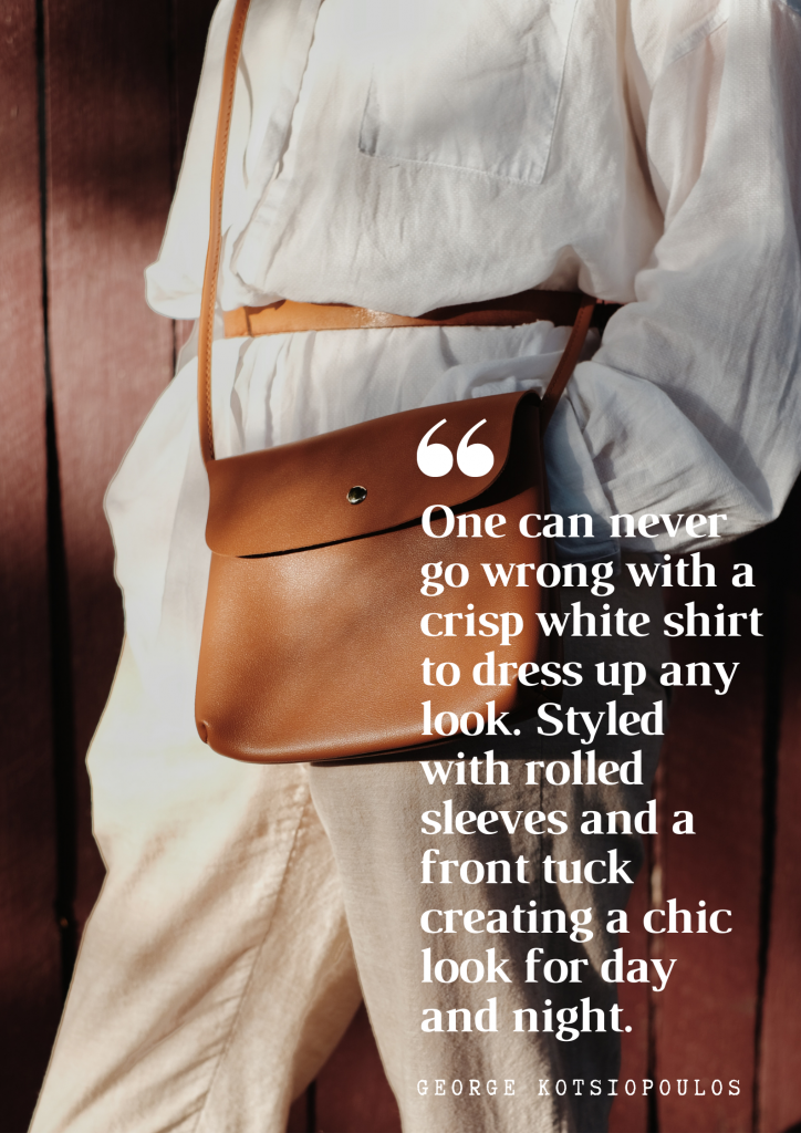 One can never go wrong with a crisp white shirt to dress up any look. Styled with rolled sleeves and a front tuck creating a chic look for day and night. - George Kotsiopoulos