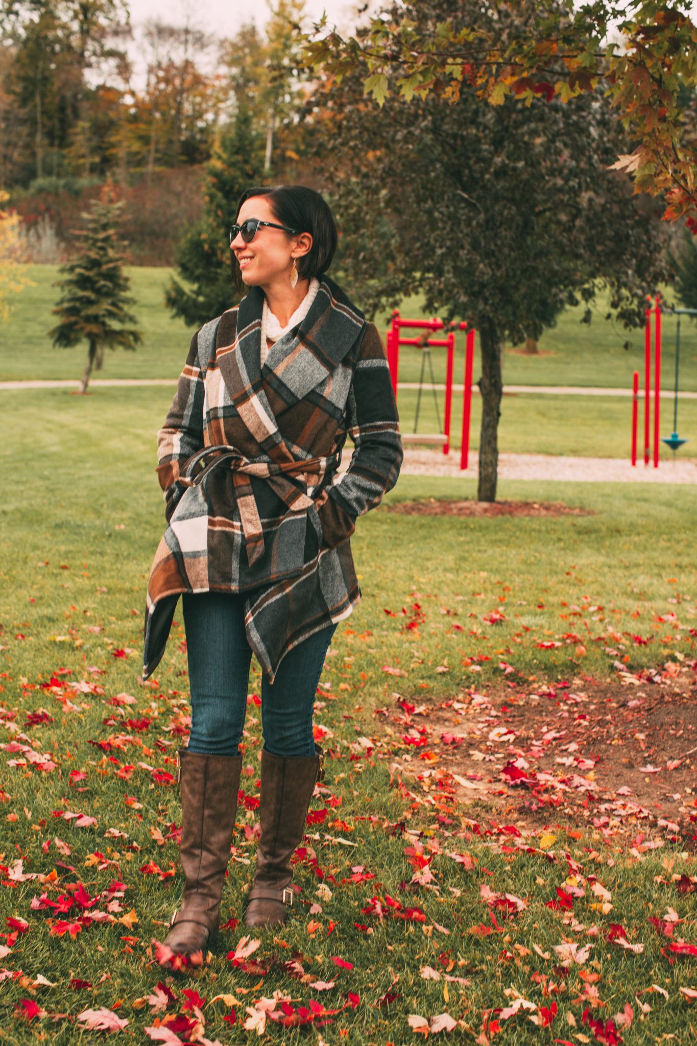 A woman wearing a Prairie Check Rabato Coat by Chicwish.