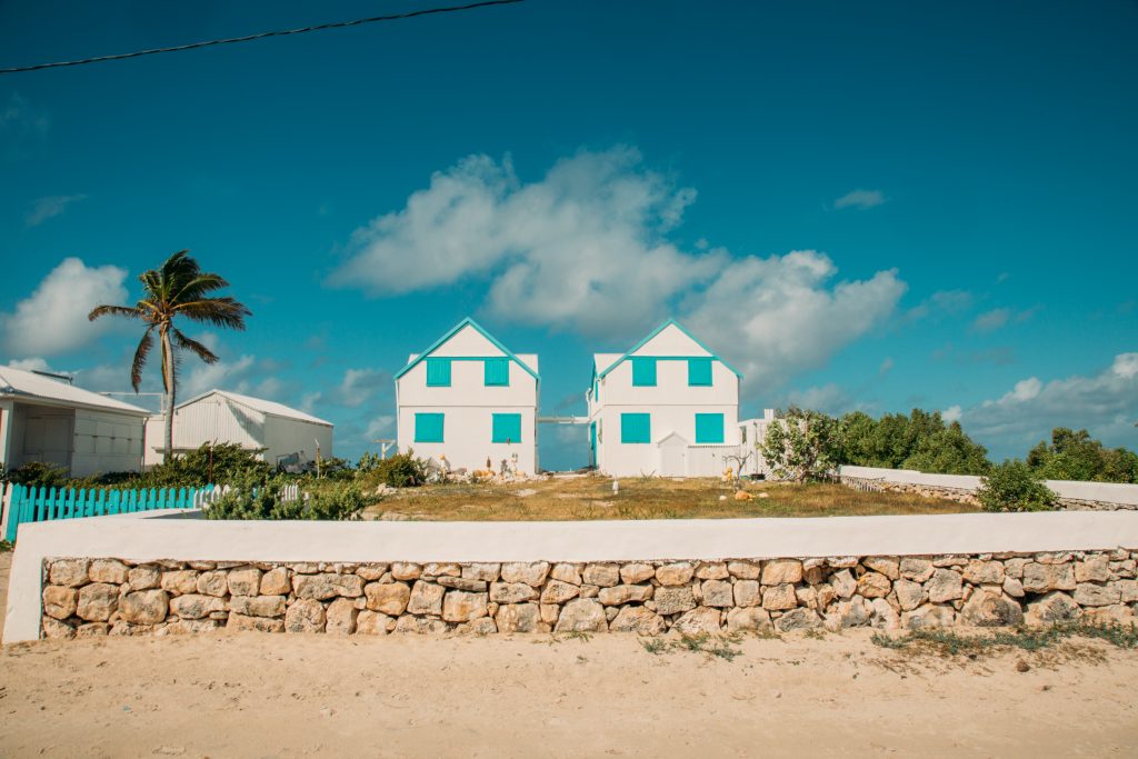 White and Blue Buildings Beautiful Homes in Salt Cay against the blue sky.